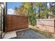 Backyard area with a gravel ground cover and wood privacy fence at 2335 Mason Dr # D27, Atlanta, GA 30316