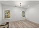Bonus room with plank walls, wood floors and natural light from the windows at 2335 Mason Dr # D27, Atlanta, GA 30316