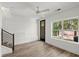 Bonus room with plank floors, modern railing, natural light, and access to outdoor space at 2335 Mason Dr # D27, Atlanta, GA 30316