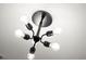 Unique six-light chandelier featuring Edison-style bulbs illuminating the ceiling at 2335 Mason Dr # D27, Atlanta, GA 30316