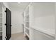 Walk-in closet with custom built-in shelving and ample storage space at 2335 Mason Dr # D27, Atlanta, GA 30316