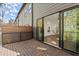 View from backyard deck through sliding glass door into the house's living room at 2335 Mason Dr # D27, Atlanta, GA 30316