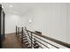 Upper hallway with wooden railing and staircase at 2335 Mason Dr # D27, Atlanta, GA 30316