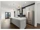 Well-lit kitchen with modern island, stainless appliances, and an open concept design at 2335 Mason Dr # D27, Atlanta, GA 30316