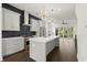 Bright, open kitchen with stainless steel appliances, island, modern lighting, and access to living space at 2335 Mason Dr # D27, Atlanta, GA 30316