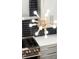Modern kitchen with stainless steel appliances, kitchen island, and decorative light fixture at 2335 Mason Dr # D27, Atlanta, GA 30316