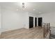 Open landing area with wood floors, modern railing, and natural light from the windows at 2335 Mason Dr # D27, Atlanta, GA 30316
