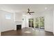 Living room with fireplace, hardwood floors, ceiling fan, recessed lights, and sliding glass door at 2335 Mason Dr # D27, Atlanta, GA 30316