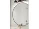 Close-up of a bathroom mirror with modern faucet and shower fixture visible in the reflection at 2335 Mason Dr # D27, Atlanta, GA 30316