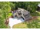 Aerial view of home showcasing the roof, driveway, and lush green landscape at 2934 Wendover St, Marietta, GA 30062