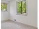 Well-lit room with neutral walls, large windows and gray carpet flooring at 2934 Wendover St, Marietta, GA 30062