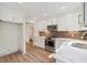 Spacious kitchen with white cabinets, marble countertops, stainless steel appliances, and breakfast bar at 2934 Wendover St, Marietta, GA 30062