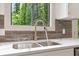 Kitchen sink with faucet and a view of the lush landscape at 2934 Wendover St, Marietta, GA 30062