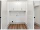 Laundry room with white cabinets and luxury vinyl plank flooring at 2934 Wendover St, Marietta, GA 30062