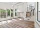 Airy living room featuring soaring ceilings, black stair railing, and light wood floors at 2934 Wendover St, Marietta, GA 30062