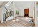 Bright living room featuring a modern fireplace, light wood floors, and open staircase at 2934 Wendover St, Marietta, GA 30062