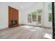 Inviting living room featuring light wood floors, contemporary fireplace, and ample natural light at 2934 Wendover St, Marietta, GA 30062