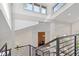 Spacious living room with a cozy fireplace and modern railings overlooking at 2934 Wendover St, Marietta, GA 30062