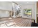 Spacious living room with high ceilings, modern staircase, and natural light enhancing light wood floors at 2934 Wendover St, Marietta, GA 30062