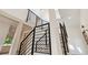 Contemporary staircase with black metal railings and lots of natural light at 2934 Wendover St, Marietta, GA 30062