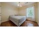 A bright bedroom offering a comfortable bed and a window offering ample natural light at 303 Cimarron Way, Lawrenceville, GA 30044