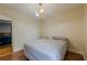 Cozy bedroom with a comfy bed, overhead lighting and hardwood floors at 303 Cimarron Way, Lawrenceville, GA 30044