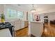 Bright kitchen with stainless appliances, center island, and hardwood floors at 303 Cimarron Way, Lawrenceville, GA 30044