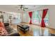 Bright living room with hardwood floors, fireplace, and sliding glass door to backyard at 303 Cimarron Way, Lawrenceville, GA 30044