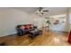 Spacious living room with hardwood floors, fireplace, and views of the kitchen at 303 Cimarron Way, Lawrenceville, GA 30044