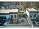 Aerial view of townhome rooftops with outdoor patio furniture and lush landscaping at 4382 Benfield Se Way, Smyrna, GA 30080