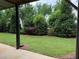 Backyard with lush green grass and trees at 4382 Benfield Se Way, Smyrna, GA 30080