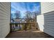 A wooden balcony overlooking a tree-lined yard and other homes at 4382 Benfield Se Way, Smyrna, GA 30080