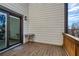 A wooden balcony with a table and chairs at 4382 Benfield Se Way, Smyrna, GA 30080