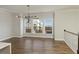 Dining area featuring an open-concept floor plan and a modern chandelier fixture at 4382 Benfield Se Way, Smyrna, GA 30080