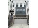 Brick townhome with a two-car garage and a dark front door at 4382 Benfield Se Way, Smyrna, GA 30080