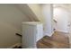 Hallway storage beneath staircase with wood floor at 4382 Benfield Se Way, Smyrna, GA 30080