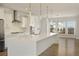 Modern kitchen with stainless steel appliances, quartz countertops, and chic pendant lighting at 4382 Benfield Se Way, Smyrna, GA 30080