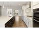 Open-concept kitchen with a spacious island, stainless appliances, and modern finishes at 4382 Benfield Se Way, Smyrna, GA 30080