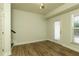 Bright living room featuring wood floors, neutral walls, and large window for ample natural light at 4382 Benfield Se Way, Smyrna, GA 30080