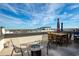 Rooftop patio with furniture, grill, and city skyline view at 4382 Benfield Se Way, Smyrna, GA 30080