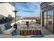 Inviting rooftop deck featuring stylish seating, fire pit, heat lamp, and skyline views, perfect for entertaining at 4382 Benfield Se Way, Smyrna, GA 30080