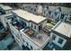 Wide angle aerial view of a rooftop deck with dining and lounge areas, along with artificial grass at 4382 Benfield Se Way, Smyrna, GA 30080