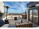 Entertainers rooftop deck includes comfortable seating, heat lamp, and skyline views at 4382 Benfield Se Way, Smyrna, GA 30080
