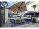 Charming rooftop deck with comfortable seating, heat lamp, and a large umbrella, ideal for outdoor relaxation at 4382 Benfield Se Way, Smyrna, GA 30080