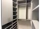 A walk-in closet with ample shelving, drawers, and hanging space at 4382 Benfield Se Way, Smyrna, GA 30080