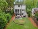 Aerial view of a private backyard with patio, lawn, and mature trees at 686 Amsterdam Ne Ave, Atlanta, GA 30306