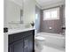 Bathroom with white tile, black vanity, and marble countertop at 686 Amsterdam Ne Ave, Atlanta, GA 30306