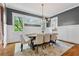 Stylish dining room with a modern light fixture, gray walls, and ample natural light at 686 Amsterdam Ne Ave, Atlanta, GA 30306