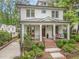 Beautifully landscaped home with brick stairs leading to a cozy covered front porch at 686 Amsterdam Ne Ave, Atlanta, GA 30306