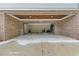 Spacious two-car garage with overhead wood trim and concrete floor at 686 Amsterdam Ne Ave, Atlanta, GA 30306